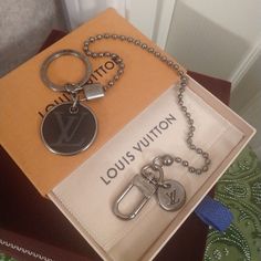 the louis vuitton key chain is in its box