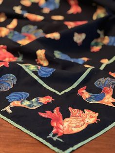 a black bandana with roosters on it