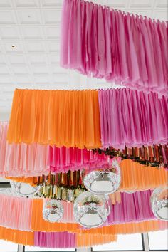 colorful streamers hanging from the ceiling in a room