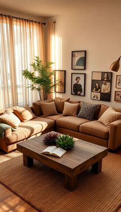 a living room with two couches, a coffee table and pictures on the wall