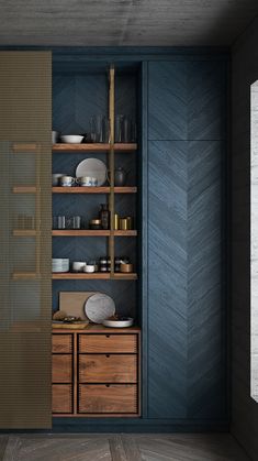 an empty room with wooden shelves and blue walls