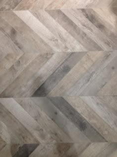 an image of wood flooring that looks like herringbones