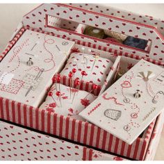 an open box with red and white designs on it