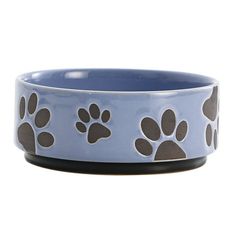 a blue bowl with brown and white paw prints on the bottom, in front of a white background