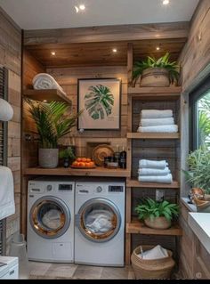 a washer and dryer in a room with wood paneling on the walls