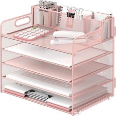 a pink desk with three drawers and a calculator