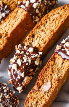 slices of cake with chocolate and nuts on top