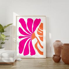 a pink and orange flower on a white wall next to two vases with one plant in it