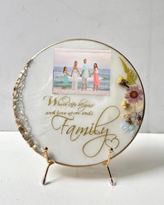 a plate with an image of two women holding hands and the words family on it