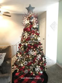 a christmas tree decorated with red, white and black ornaments