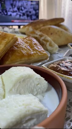 some food is sitting on a table and ready to be eaten by the people in the room