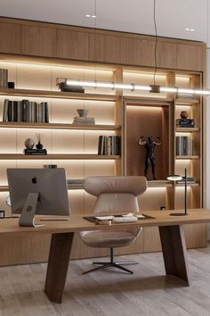 an office with a desk, chair and bookshelf full of shelves filled with books