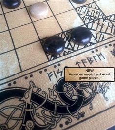 an american marble hand - carved game pieces are displayed on a board with the words, new american marble hard wood games pieces