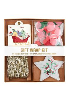 the gift wrap kit includes two star shaped decorations and one small christmas ornament