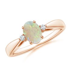 an opal and diamond ring in rose gold