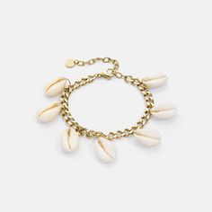 "Beach vibes only in this puka shell charm bracelet. All around a tarnish resistant 14K gold curb chain for a modern, vacation-ready look. MATERIALS 14K Gold plating Puka Shells Stainless steel Lobster claw clasp 100% nickel free 100% Hand made with care Comes with a Victoria Emerson pouch for perfect storage!  SIZE Length: 7\" 2\" extension" Puka Shell Bracelet, Victoria Emerson, Gold Curb Chain, Puka Shell, Shell Bracelet, Gold Piece, Beach Vibes, Curb Chain, Tulum