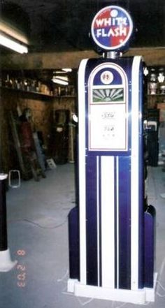 an old fashioned gas pump in a garage