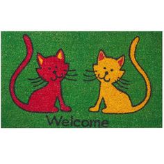 a welcome mat with two cats on it