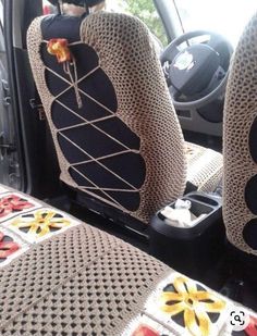 two seats in the back of a car with no covers on them, and one has an orange flower