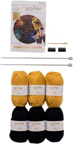 harry potter knitting kit with yarn, needles and two balls of yarn in black and yellow