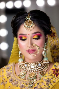 #Indianbridalmakeup is a vast subject to discuss with everyone having their own take and taste in it. But what we see currently in #fashion is the rainbow eye makeup for the #brides who are really ready to experiment with something different. Though this makeup trend is perfect to wear for pre-wedding ceremonies like the Mehndi or the Haldi, one can also try it with the bridal look. Here are a few inspirational pictures…

#Threads Bride Eye Makeup, Bridal Makup, Latest Bridal Makeup, Rainbow Eye Makeup, Bridal Makeup Images