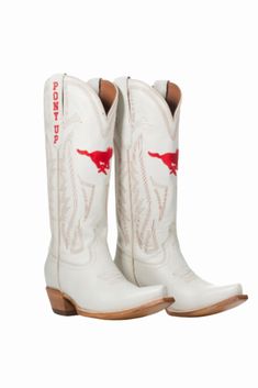 Women's Collegiate Gameday Boots in Ivory Details Available in sizes 5 - 13 INCLUDING 1/2 SIZES Premium Geniune Ivory Leather Goodyear Welt Construction Memory Foam Insole Smooth Leather Lining Natural Stacked Wood Heel Western Embroidery Stitching Embroidered Team Logos Snip-toe Pull on Style with V Front and Back 14" Shaft Height and Circumference CLC Approved Sizing Sizes 5 - 13 to include 1/2 sizes! Fit Boots run 1/2 size small. Size up 1/2 size. Western Embroidery, Embroidery Stitching, Bow Headband Hairstyles, Florida Georgia, Wood Heel, Ole Miss, Tech Gifts, Goodyear Welt, Grey Denim