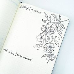 an open notebook with flowers and writing on it