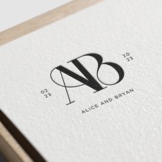 the letter n is inscribed in black and white on a piece of paper that reads, alice and blyvan