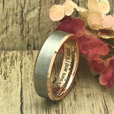 two wedding bands that have been engraved on them