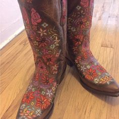 These Gently Used Black Star Sweetgrass (Tan/Multicolored) Women's Cowboy Boots Have Bly Been Worn Twice. Black Star Only Makes Hand-Fashioned Women's Boots With Gorgeous, Unique Styling Featuring Unparalleled Detailed Quality And Comfort. They Are Known For Being Extremely Comfortable. Only The Finest Materials Are Used By Expert Artisans Who Have Been Making Boots For Generations. Sweetgrass Showcases Exquisite Embroidery In A Beautiful Array Of Colors With A Rich, Distressed Tan Leather. Accented By Genuine Swarovski Crystals. Details Include A Snip Toe, 1.5" Leather Heel, Pegged And Nailed Leather Sole, Mid-Calf Height, Seam-Covering Inside Shaft Lining, And Extra Soft Insole Cushionin Comfort Pictures, Women's Cowboy Boots, Unique Styling, Embroidered Boots, Cowboy Boots Women, Black Star, Leather Heels, Mid Calf, Tan Leather