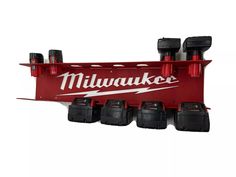 a red truck with six black batteries attached to it's side and the word milwaukee on the back