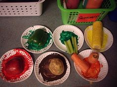 paper plates filled with different types of food