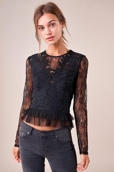 The Temptress is a sheer lace top covered in a floral design. The top features a high neckline, long fitted sleeves, and a darted bodice with a cropped, pleated hem. This ultra-sultry number is perfect for showing off your midriff in jeans and heels. Model is 5'9" and wearing size small. Pre-Order Now! Estimated Shipping Date October 25, 2019. Available in black. 100% polyester. Imported. Lace Shirt Outfit, Long Sleeve Lace Crop Top, Lace Undershirt, Floral Top Outfit, Black Lace Shirt, Women Lace Blouse, Black Lace Crop Top, Sugar Lips, Black Lace Blouse