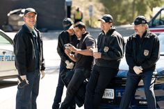 four police officers standing next to each other