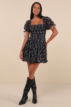 You'll be the first thing on your sweetie's mind in the Lulus Delightful Crush Black Floral Smocked Puff Sleeve Mini Dress! Lightweight woven fabric, with a burnout design and ditsy floral print throughout, shapes short puff sleeves with elastic cuffs and bow details. Ruffle-trimmed square neckline tops a smocked bodice with a fitted waist. Flaring skirt finishes at a bubble-style mini hem. Fit: This garment fits true to size. Length: Mid-thigh. Size medium measures 26.5" from shoulder to hem. B Smocked Mini Dress, Bubble Style, Dress With Puff Sleeves, Tier Dress, Puff Sleeve Mini Dress, Floral Dresses Short, Tiered Ruffle Dress, Be First, Ditsy Floral Print