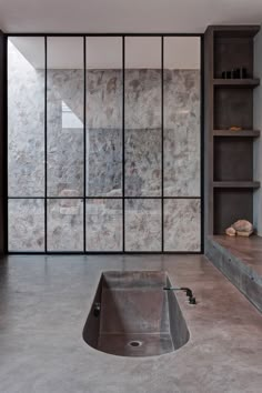 a bathroom with a sink and shelves in it