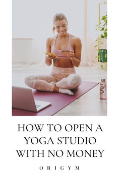 a woman sitting on a yoga mat looking at her cell phone and holding a smart phone