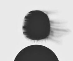 an abstract black and white photo of two circles