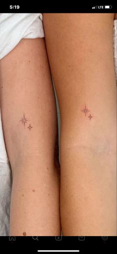 two women's butts with small stars on the back of their thighs, both showing