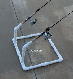 two white pipes connected to each other on the ground with words above them that read ae smith