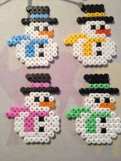 four snowmen made out of perler beads