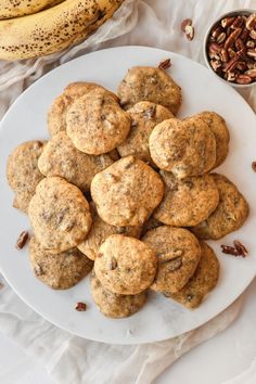 a white plate topped with cookies and pecans