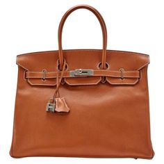 Hermès Fauve Barenia Faubourg Birkin 35 Palladium Hardware. Very special and in high demand bag. Signature Barenia leather, the most popular leather they use for saddles. The way the leather ages is unique and it has its own character and beauty. A stamp, 2017. The interior is lined in a tonal chèvre leather Includes lock, two keys, clochette, clochette dust bag, care booklet, raincoat, felt protector, dust bag, and box Fashion Handbags, Luxury Bags, Dust Bag, Top Handle Bag, Handbags, Leather