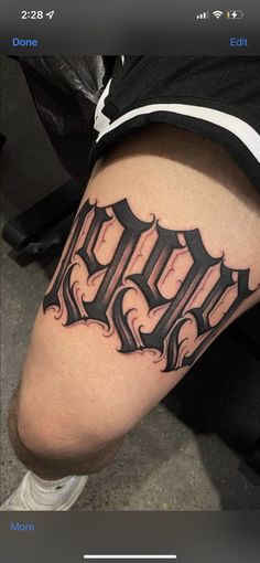 a person with a tattoo on their leg that has the letters d and f in it