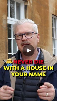 a man with glasses and a mustache standing in front of a building, texting never die with a house in your name