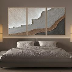 three paintings on the wall above a bed