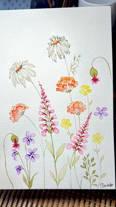 watercolor painting of flowers on white paper