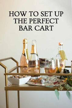 a bar cart with bottles and glasses on it that says how to set up the perfect bar cart