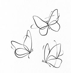 three butterflies drawn in black ink on white paper