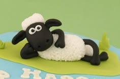 a cake with a sheep laying on top of it